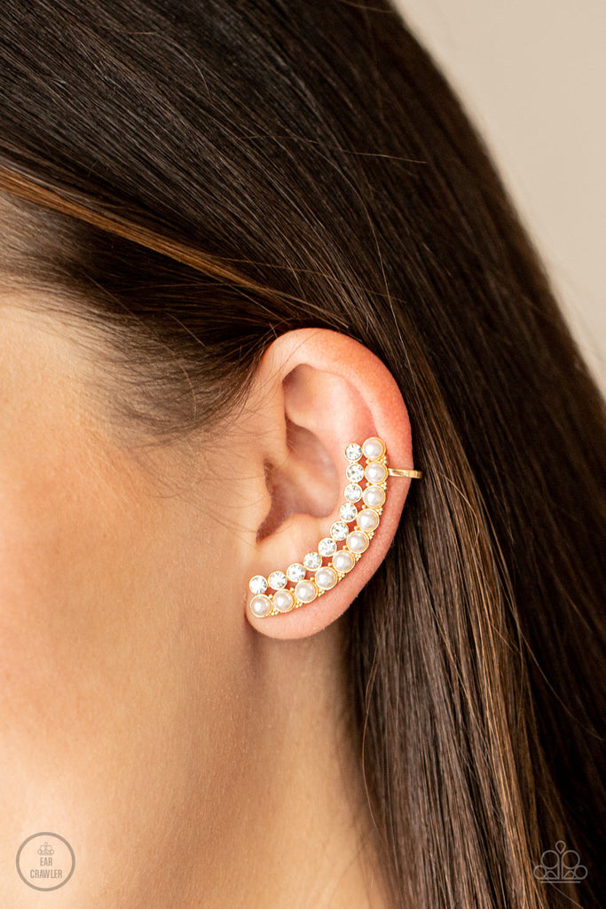 doubled-down-on-dazzle-gold  Featuring classic gold fittings, two rows of dainty white pearls and glassy white rhinestones arch into a timeless statement piece. Earring attaches to a standard post earring. Features a clip-on fitting at the top for a secure fit.  Sold as one pair of ear crawlers.