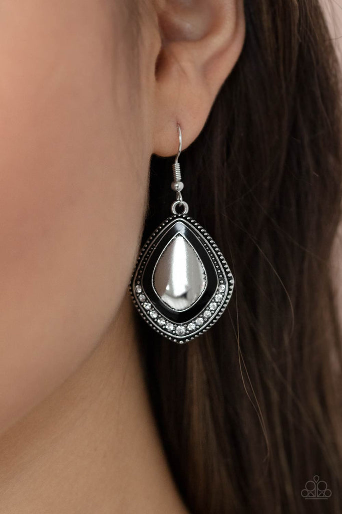 Painted in a shiny black accent, the bottom of a studded silver frame is bordered in a dainty row of white rhinestones for a fearless finish. Earring attaches to a standard fishhook fitting.  Sold as one pair of earrings.