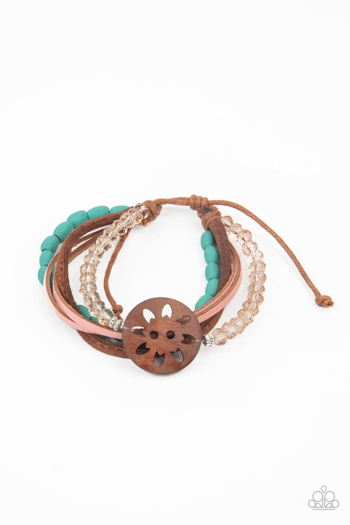 desert-gallery-blue Featuring a wooden floral centerpiece, mismatched strands of turquoise wooden beads, pink leather, brown suede, and topaz crystal-like beads layer across the wrist for a seasonal flair. Features an adjustable sliding knot closure.  Sold as one individual bracelet.