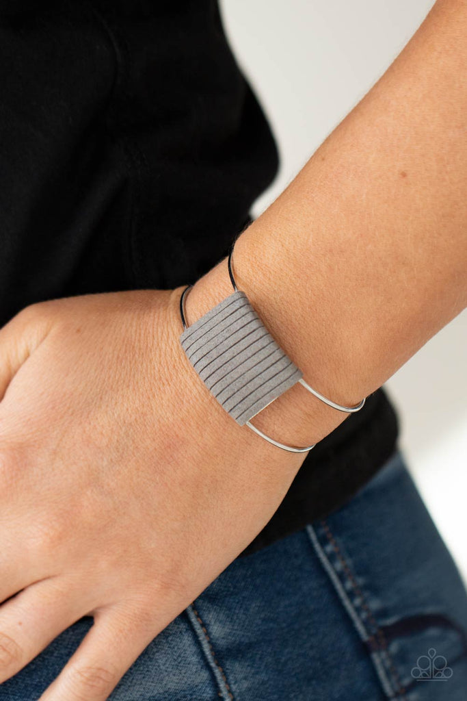 Ultimate Gray suede cording wraps around a silver fitting nestled between an airy silver cuff, creating a colorfully rustic centerpiece.  Sold as one individual bracelet.  New Kit