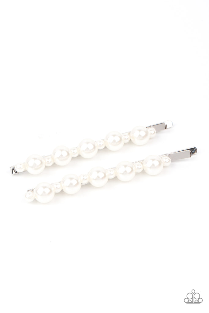Dainty and classic pearls alternate along a pair of silver bobby pins, creating a bubbly display.  Sold as one pair of decorative bobby pins.