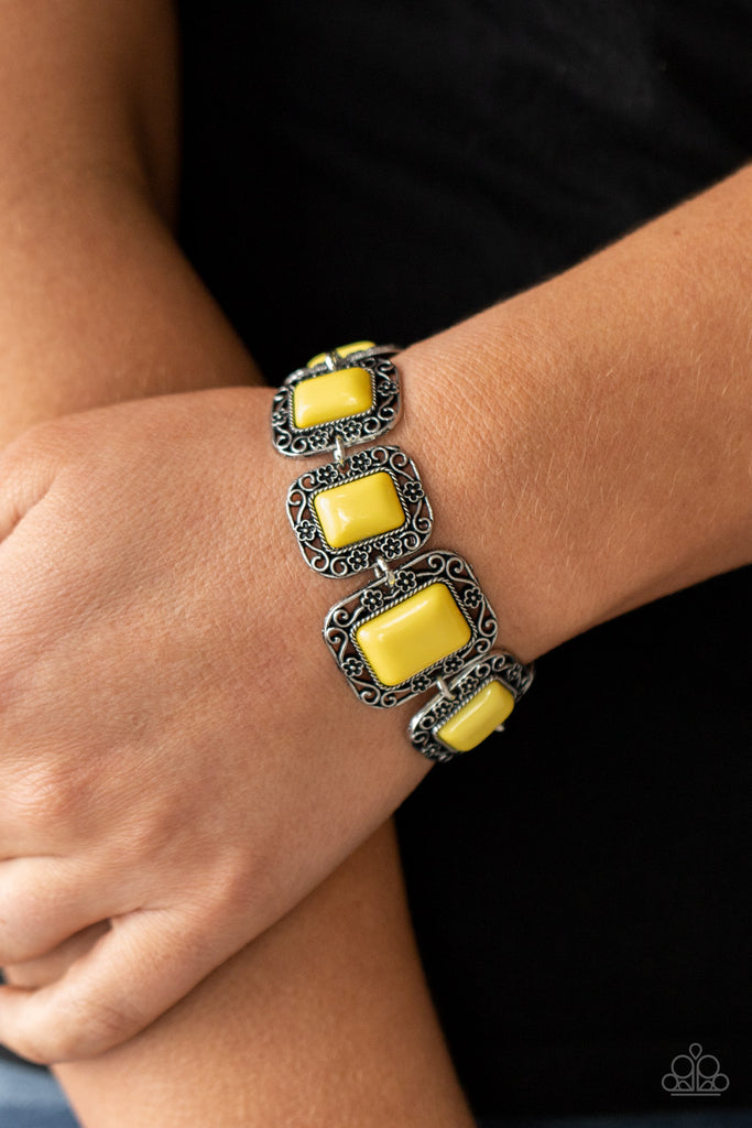 A flirty collection of Illuminating rectangular beads are bordered by rustic floral filigree-filled frames as they delicately link around the wrist for a whimsical flair. Features an adjustable clasp closure.  Sold as one individual bracelet.