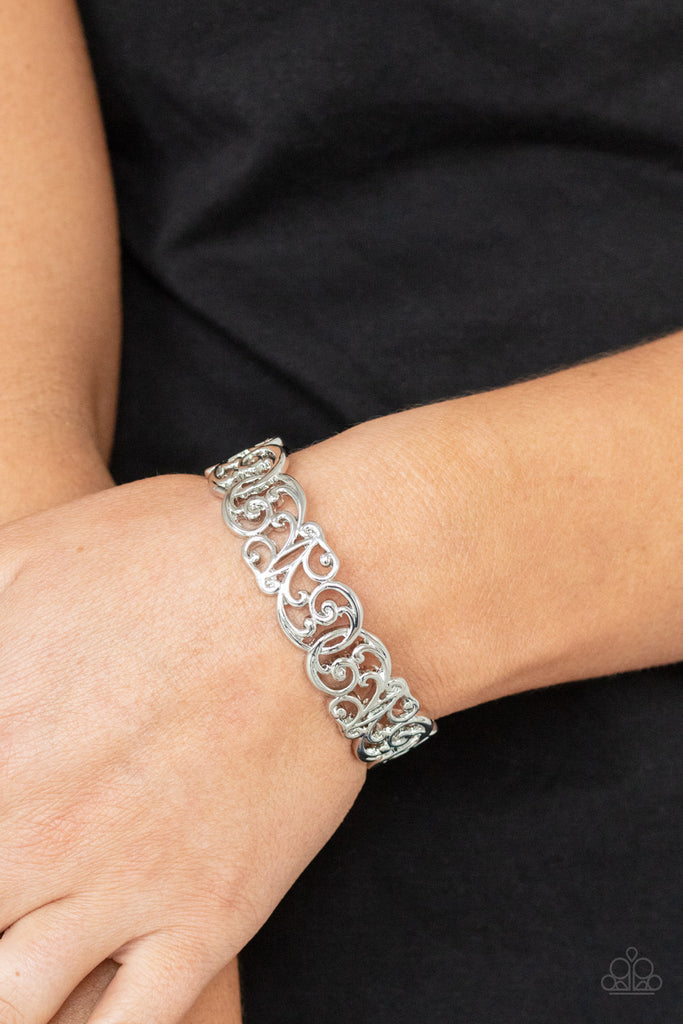 Brushed in a high sheen shimmer, vine-like silver filigree delicately curls around the wrist, creating a vintage inspired cuff.  Sold as one individual bracelet.  