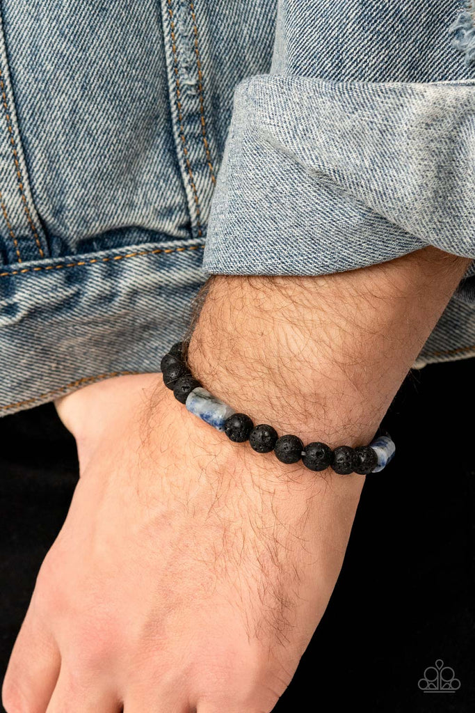 Refreshing blue stone accents and black lava rock beads are threaded along a stretchy band around the wrist, creating a colorful seasonal display around the wrist.  Sold as one individual bracelet.
