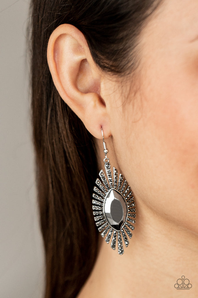 Dotted in dainty hematite rhinestones, flared rectangular frames fan out from an oversized marquise shaped center, creating a dramatic effect. Earring attaches to a standard fishhook fitting.  Sold as one pair of earrings.