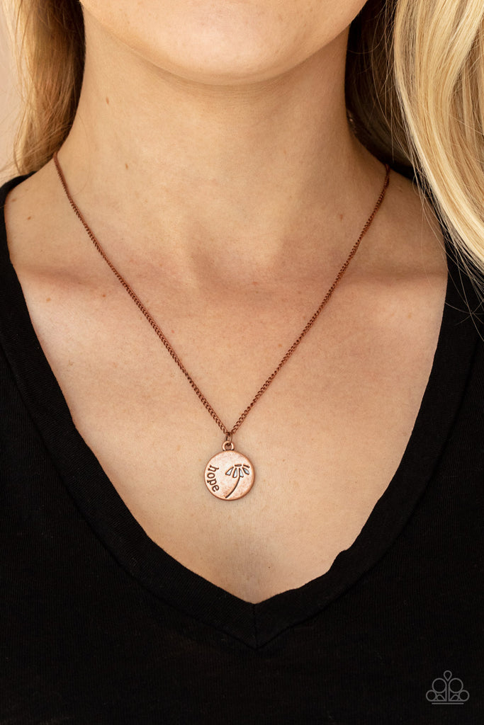 Stamped in a whimsical flower, a dainty copper disc is stamped in the word, "Hope," creating an inspirational pendant below the collar. Features an adjustable clasp closure.  Sold as one individual necklace. Includes one pair of matching earrings.  