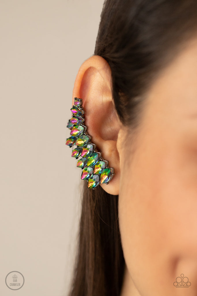 An explosion of marquise-cut oil spill rhinestones delicately climb the ear, coalescing into a smoldering frame. Earring attaches to a standard post fitting. Features a clip-on fitting at the top for a secure fit.  Sold as one pair of post earrings.