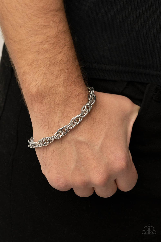 Double linked silver ovals spin into a bold silver chain around the wrist, creating an intense industrial display. Features an adjustable clasp closure.  Sold as one individual bracelet.