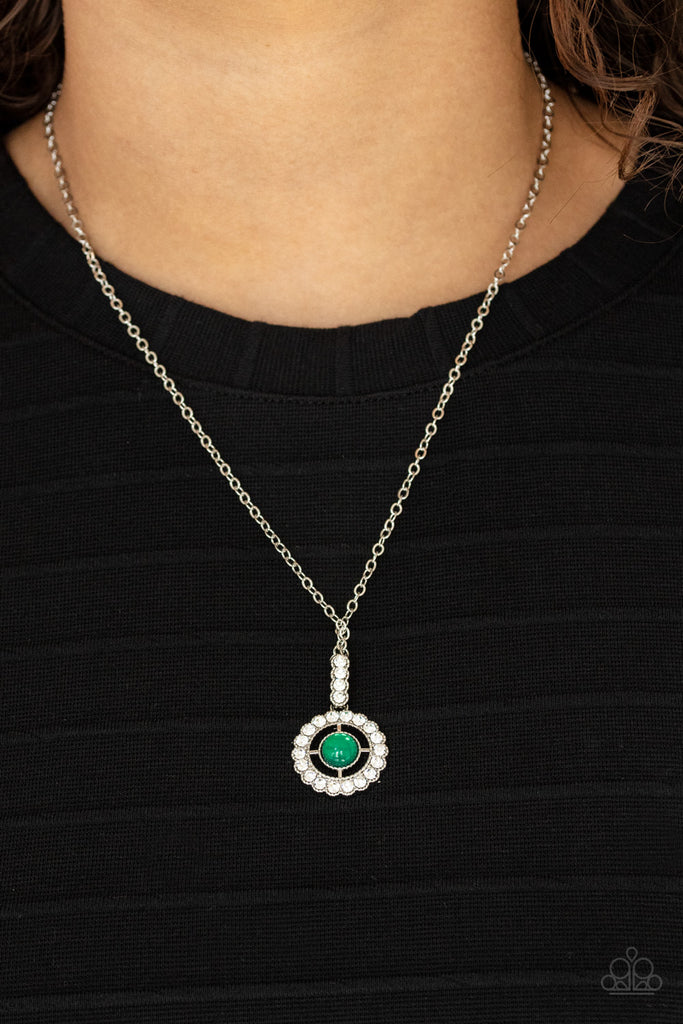 A white rhinestone encrusted fitting attaches to a ring of white rhinestones dotted with a glassy Mint beaded center, creating a twinkly pendant at the bottom of a classic silver chain. Features an adjustable clasp closure.  Sold as one individual necklace. Includes one pair of matching earrings.