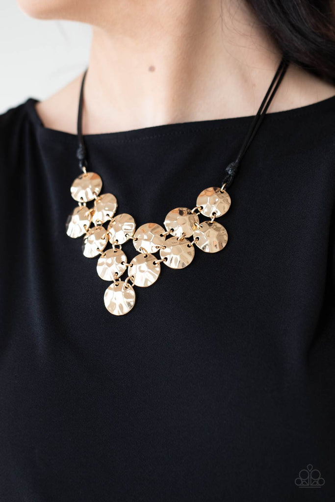 Featuring a hammered finish, a collection of glistening gold discs delicately connect into a netted pendant at the bottom of knotted black cords for a statement-making look. Features an adjustable clasp closure.  Sold as one individual necklace. Includes one pair of matching earrings.  