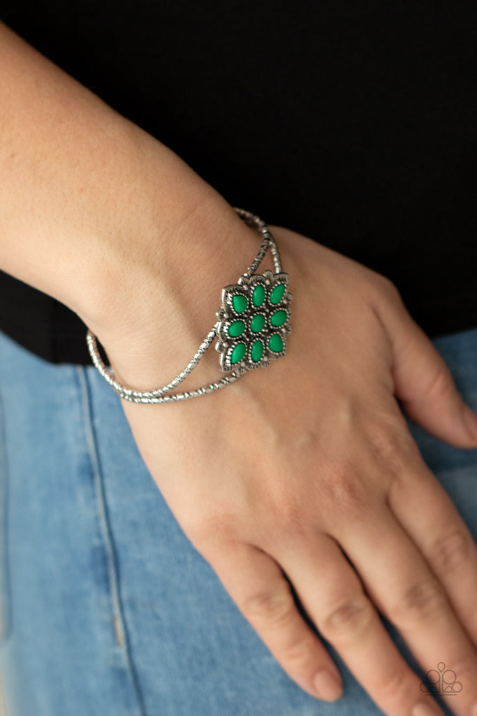 Mint teardrop beads embellish a decoratively studded frame atop a textured silver cuff, creating a whimsical pop of color atop the wrist.  Sold as one individual bracelet.