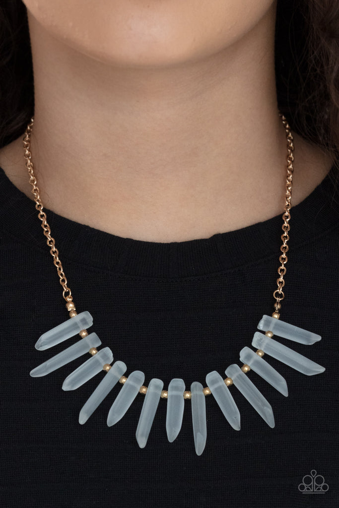 Separated by dainty gold beads, an opaque collection of glassy-like icicle beads fans out below the collar, creating an icy fringe. Features an adjustable clasp closure.  Sold as one individual necklace. Includes one pair of matching earrings.