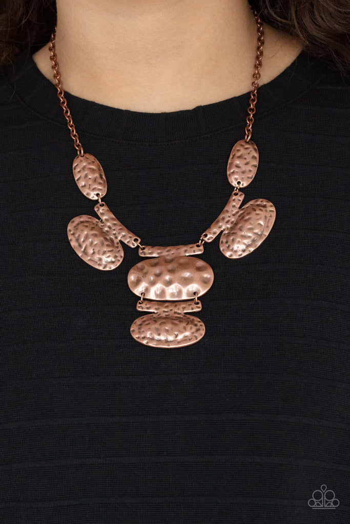 Attached to bar-like plates, mismatched copper oval plates link below the collar, creating an intense industrial statement below the collar. Features an adjustable clasp closure.  Sold as one individual necklace. Includes one pair of matching earrings.