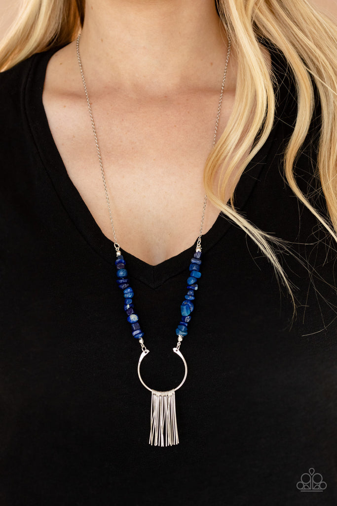 Dainty silver rods swing from the bottom of a bowing silver fitting that attaches to sections of lapis pebbles at the bottom of a silver chain, creating a whimsically seasonal display. Features an adjustable clasp closure.  Sold as one individual necklace. Includes one pair of matching earrings.  