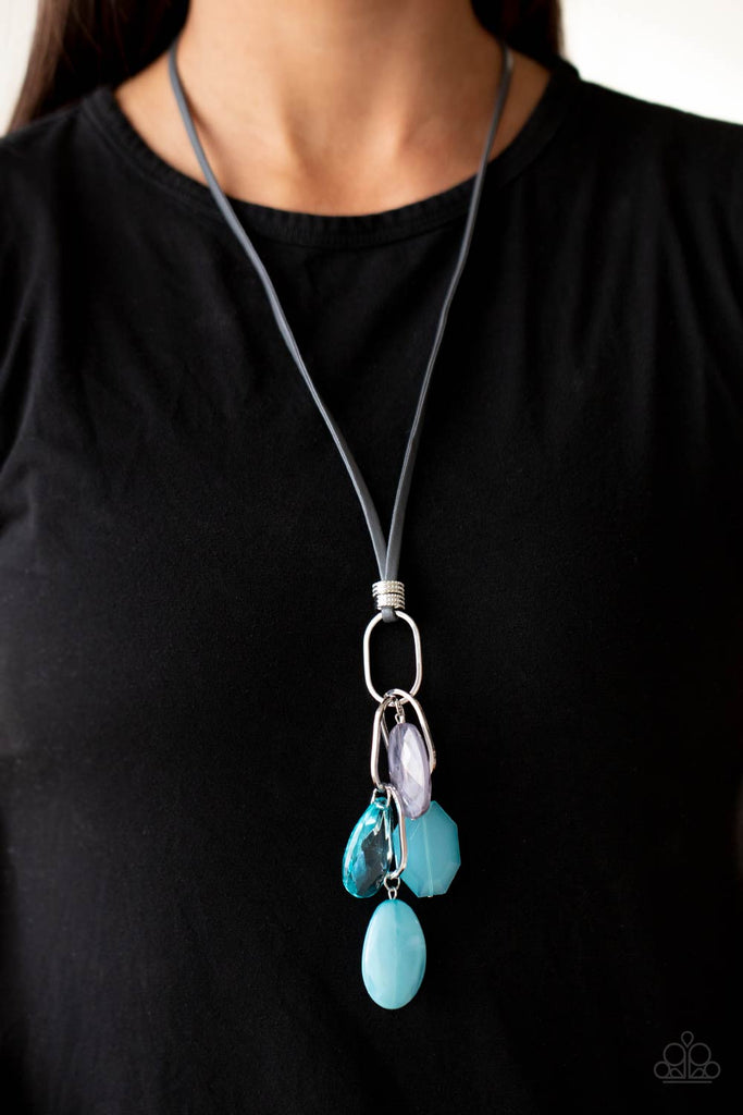 A lively mixture of oversized silver oval links and turquoise and gray acrylic beads swing from a lengthened gray leather cord. The transparent turquoise teardrop, cloudy turquoise octagon, and marbled oval shapes create a flirty statement. Features an adjustable clasp closure.  Sold as one individual necklace. Includes one pair of matching earrings.