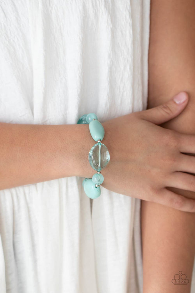 Featuring glassy, opaque, and solid finishes, an array of Blue Radiance faux stone beads and dainty silver beads are threaded along a stretchy band around the wrist for a boldly colorful fashion.  Sold as one individual bracelet.