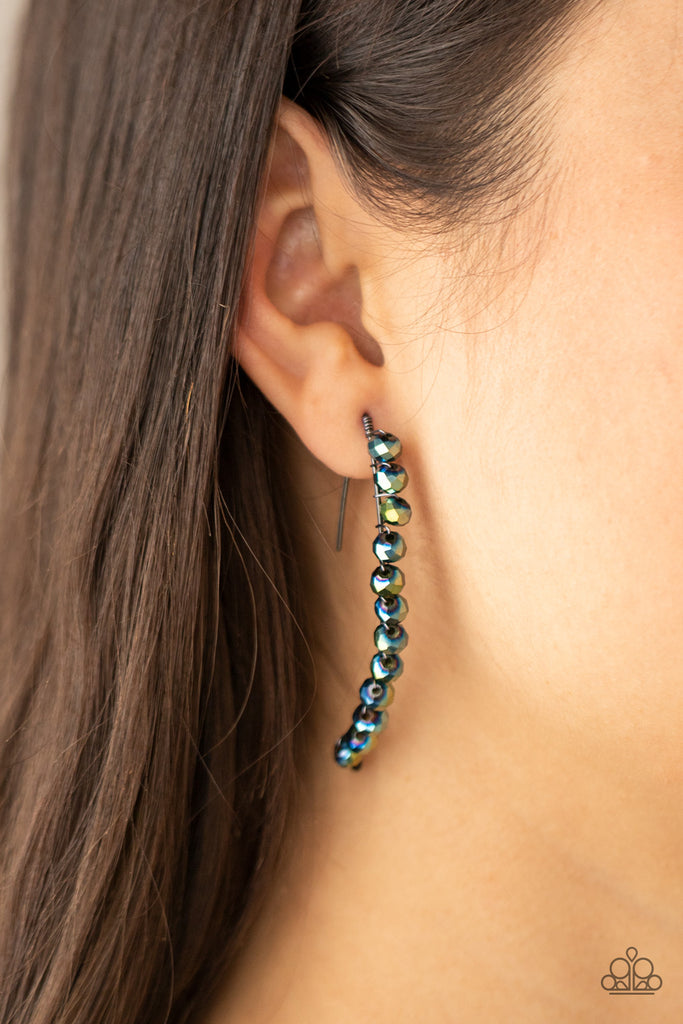 A glittery collection of iridescent flecked metallic blue rhinestones are fitted in place along a curved gunmetal wire, creating a glamorous hanging post. Earring attaches to a standard hanging post fitting.  Sold as one pair of post earrings.