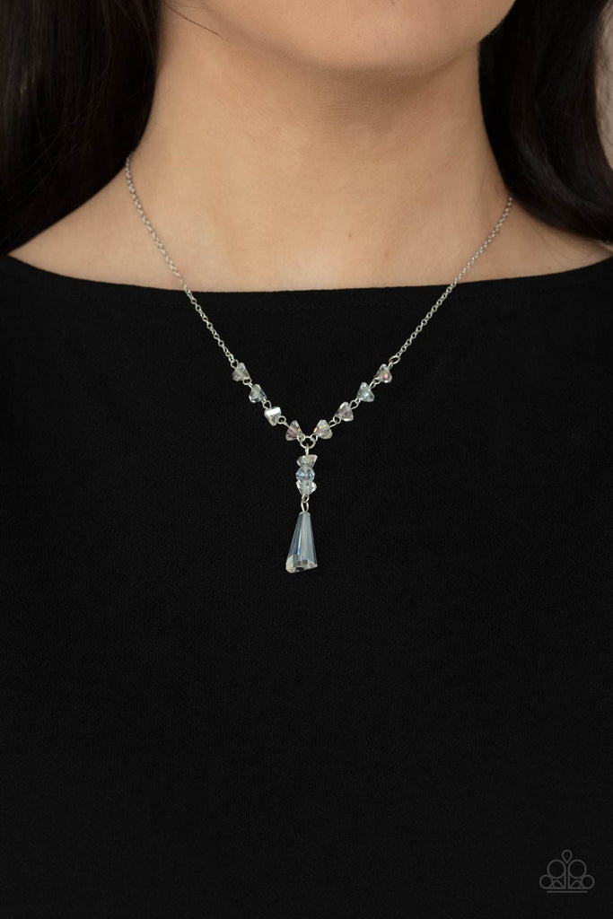 Featuring an iridescent shimmer, raw cut glassy beads trickle along a dainty silver chain, giving way to a tranquil crystal-like pendant below the collar. Features an adjustable clasp closure.  Sold as one individual necklace. Includes one pair of matching earrings.  New Kit