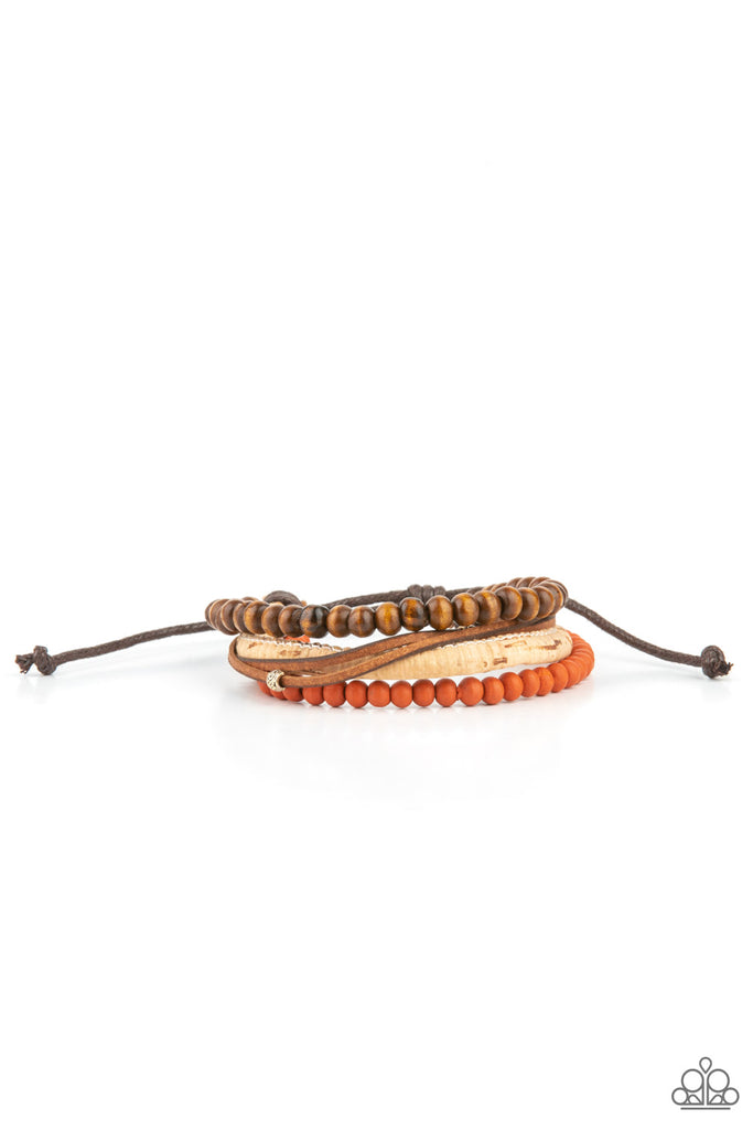 Featuring a strand of orange wooden beads, a collection of earthy strands of cork, leather, and wood, comes together for a simple handmade feel as it stacks up the wrist. Features an adjustable sliding knot closure.  Sold as one individual bracelet.