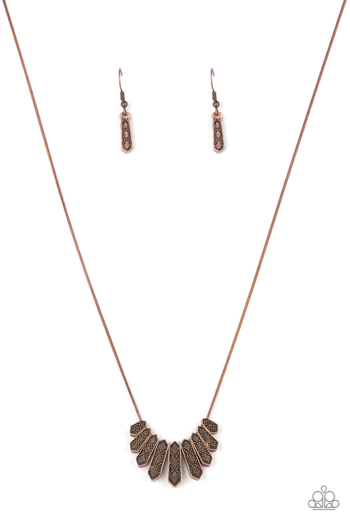 A row of copper obelisk-like monuments gradually decrease in size as they fan out across the collar. Delicately embossed with textured diamond shapes, they march along a dainty round copper chain. Features an adjustable clasp closure.  Sold as one individual necklace. Includes one pair of matching earrings.