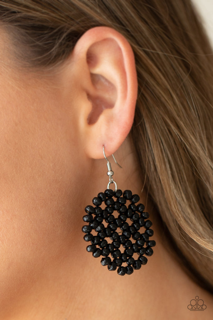 Clusters of dainty black wooden beads are threaded along invisible wire, creating a vivacious floral pattern frame for a summery flair. Earring attaches to a standard fishhook fitting.  Sold as one pair of earrings.