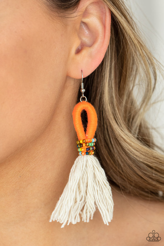A tassel of soft white cotton fans out under rows of brightly colored seed beads. Anchored by a loop of vibrant orange floss, the eye-catching style swings from the ear for a show-stopping statement. Earring attaches to a standard fishhook fitting.  Sold as one pair of earrings.  