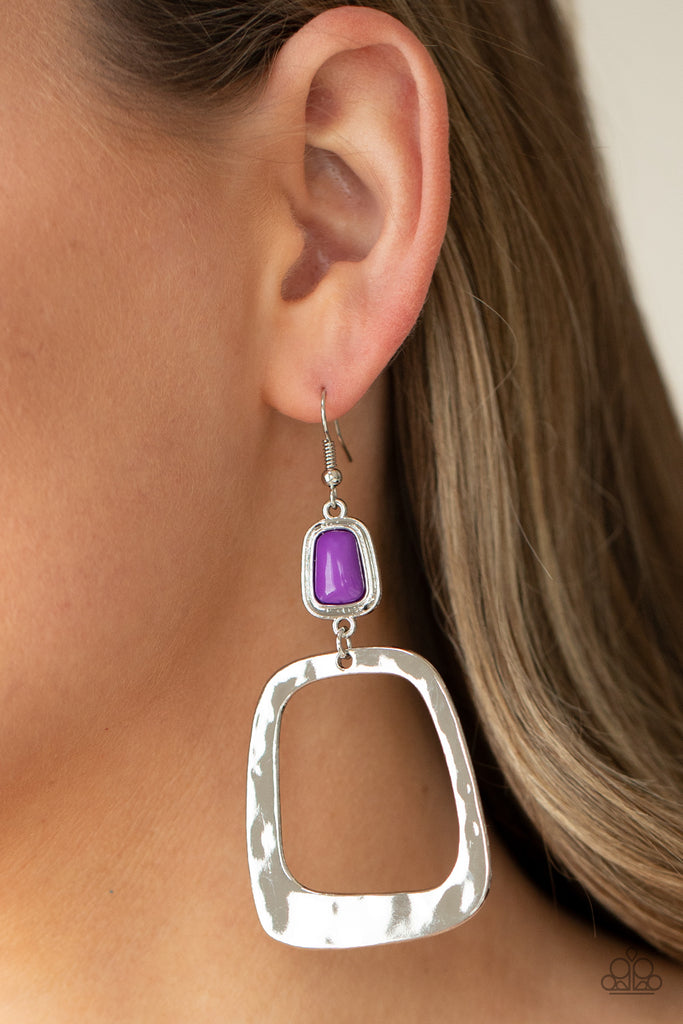 An oversized square hoop, delicately hammered for a shiny texture, dangles from a rectangular purple bead pressed into a silver frame for a dramatic modern material girl display. Earring attaches to a standard fishhook fitting.  Sold as one pair of earrings.