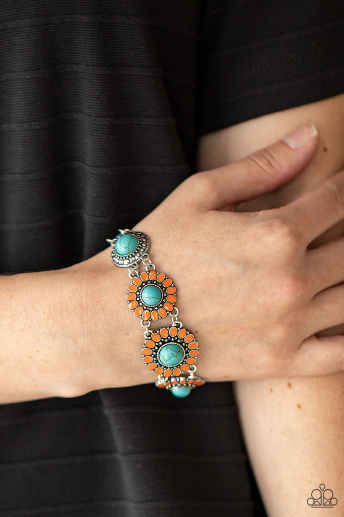Featuring refreshing turquoise stone centers, studded silver frames double-link with Marigold petaled floral frames around the wrist for a colorfully seasonal look. Features an adjustable clasp closure.  Sold as one individual bracelet.  New Kit