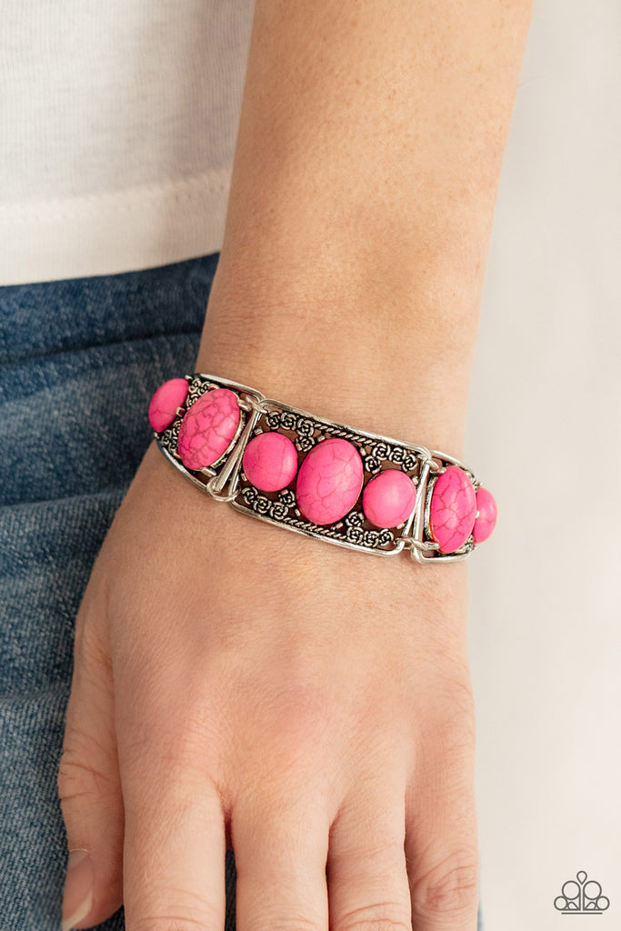Pink oval stones are encrusted along the center of antiqued silver frames dotted with dainty rosebuds as they delicately connect into an adjustable cuff-like display around the wrist. Features an adjustable clasp closure.  Sold as one individual bracelet.