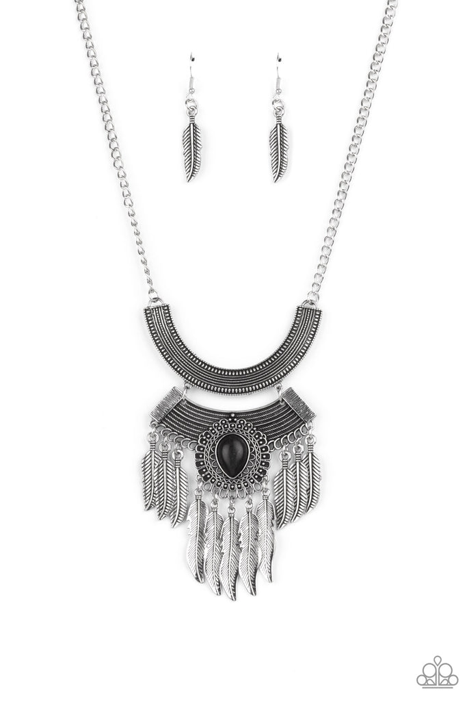 A black teardrop stone dots an ornately scalloped silver frame that adorns the center of a curved metal plate that links to the bottom of an oversized curved studded plate. Mismatched silver feathers trickle from the bottom of the stacked pendant, creating a whimsical fringe. Features an adjustable clasp closure.  Sold as one individual necklace. Includes one pair of matching earrings.