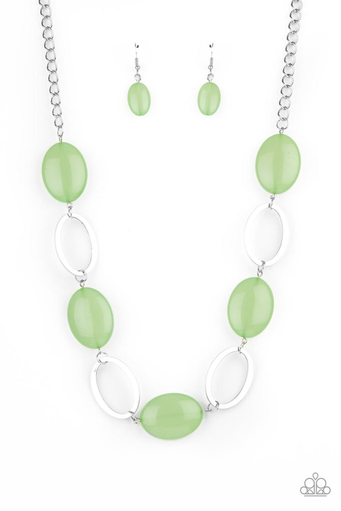 Shiny silver ovals and glassy green oval beads delicately link across the chest, creating a whimsical pop of color. Features an adjustable clasp closure.  Sold as one individual necklace. Includes one pair of matching earrings.