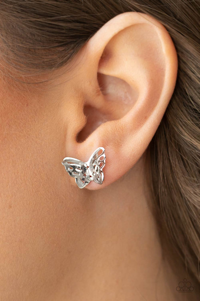 Delicately stenciled in airy cutouts, two layers of silver wings delicately overlap into a fluttery butterfly for a whimsical fashion. Earring attaches to a standard post fitting.  Sold as one pair of post earrings.  