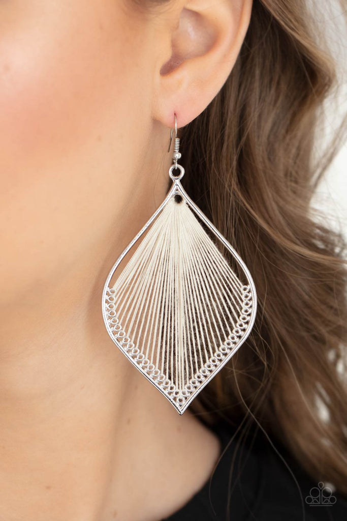 White string is threaded through small hoops inside a silver mandala-shaped frame for a vibrant artistic adornment. Earring attaches to a standard fishhook fitting.  Sold as one pair of earrings.