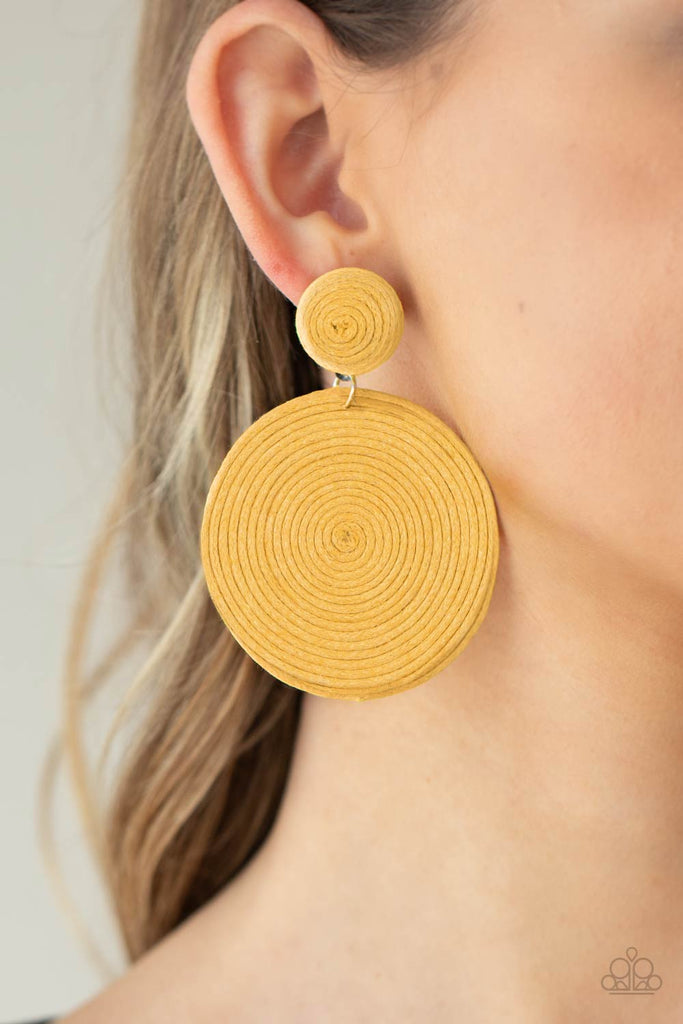 A generous disc of yellow thread spirals around and around for a dizzying finish as it connects to a yellow threaded button post. Earring attaches to a standard post fitting.  Sold as one pair of post earrings.