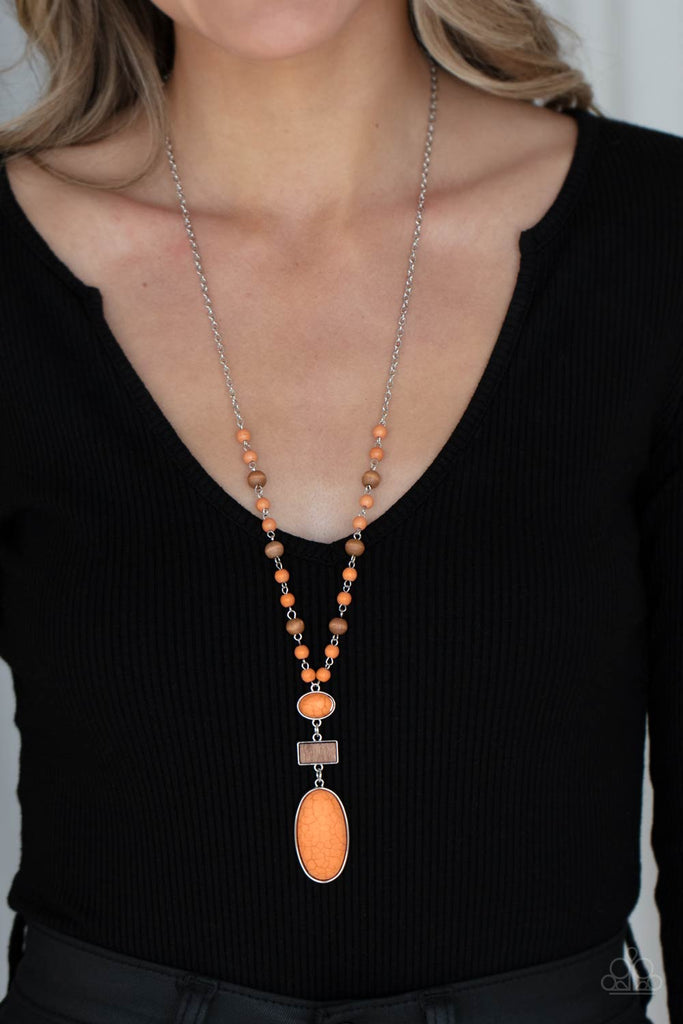 naturally-essential-orange  A dainty collection of Rust stone and rustic wooden beads connects into an earthy chain across the chest. Featuring sleek silver frames, oval stones and a rectangular wood frame connect into a dramatically stacked seasonal pendant at the bottom of the colorful display. Features an adjustable clasp closure.  Sold as one individual necklace. Includes one pair of matching earrings.