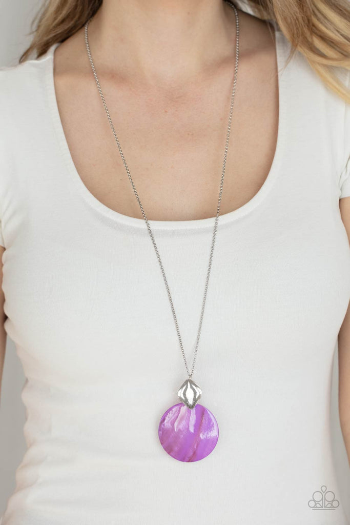 Featuring a glistening iridescence, a Lavender shell-like disc attaches to a shiny silver frame at the bottom of a lengthened silver chain, creating a summery pendant. Features an adjustable clasp closure.  Sold as one individual necklace. Includes one pair of matching earrings.