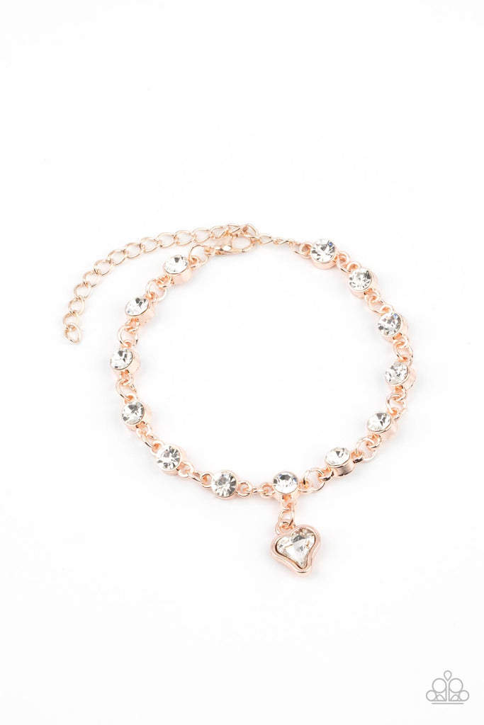 sweet-sixteen-rose-gold Brilliant white rhinestones in rose gold settings are linked together and accented with a charming white rhinestone heart that dangles sweetly from the wrist. Features an adjustable clasp closure.  Sold as one individual bracelet.