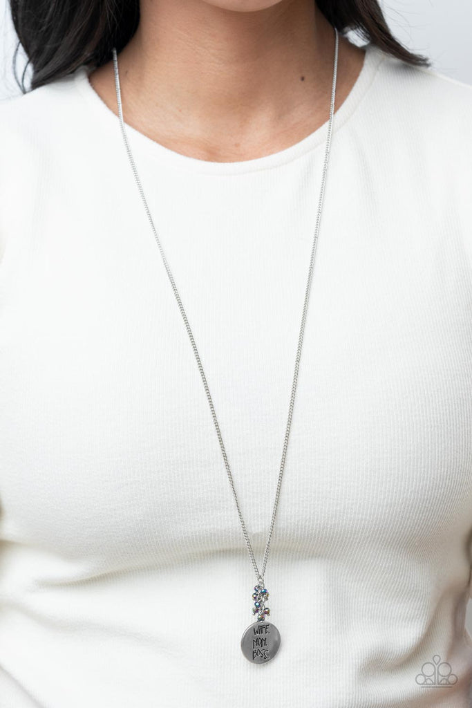 A silver disc inscribed with the words, "Wife. Mom. Boss." creates a stylish namesake as it falls from a lengthened silver chain. A sprinkle of dainty iridescent oil spill beads adds a decorative fringe atop the memento. Features an adjustable clasp closure.  Sold as one individual necklace. Includes one pair of matching earrings.