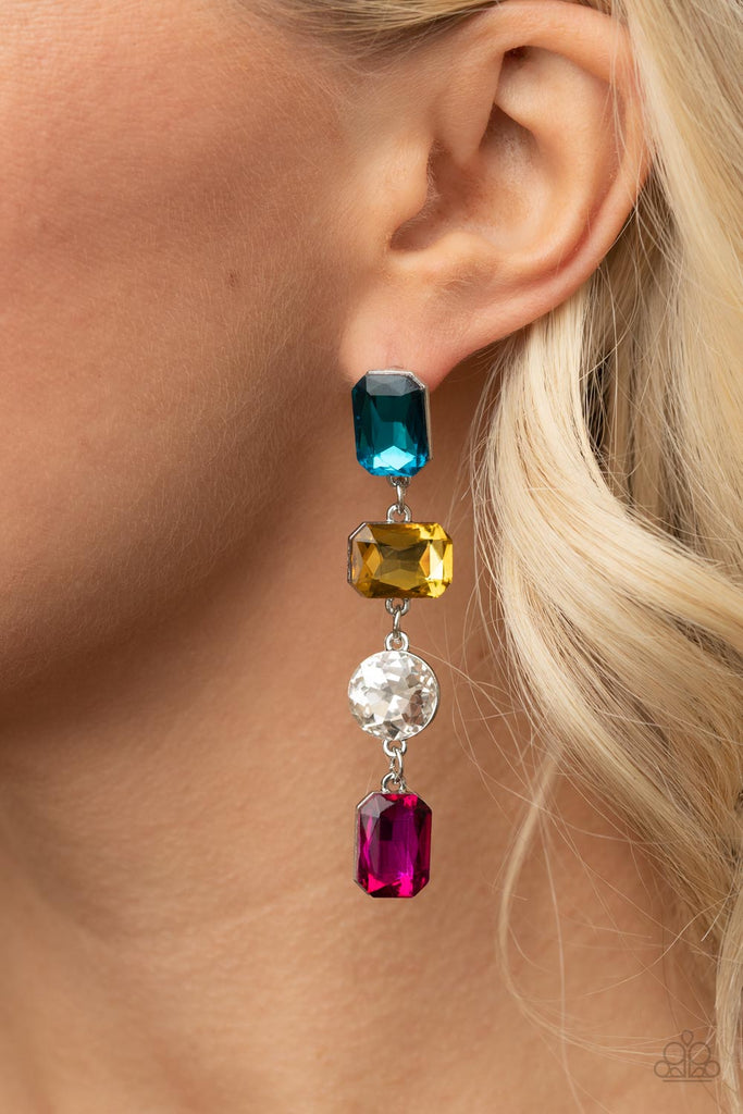 A strand of oversized round, teardrop, and emerald cut blue, yellow, white, and pink rhinestones trickles from the ear, creating a jaw-dropping chandelier. Earring attaches to a standard post earring.  Sold as one pair of post earrings.