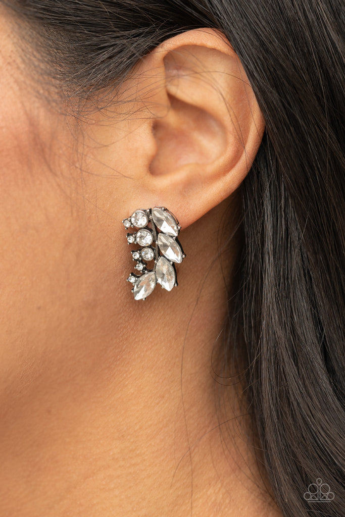 A frond of dazzling white marquise and round rhinestones delicately curves below the ear for a flawless finish. Earring attaches to a standard post fitting.  Sold as one pair of post earrings.