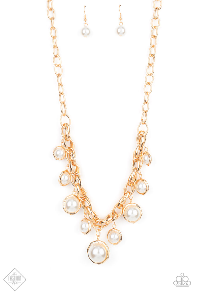 Classic white pearls and solitaire pearls that are threaded along a rod inside imperfect gold rings swing from a chunky section of double-linked gold chain, creating a dramatic display across the chest. Features an adjustable clasp closure.  Sold as one individual necklace. Includes one pair of matching earrings.