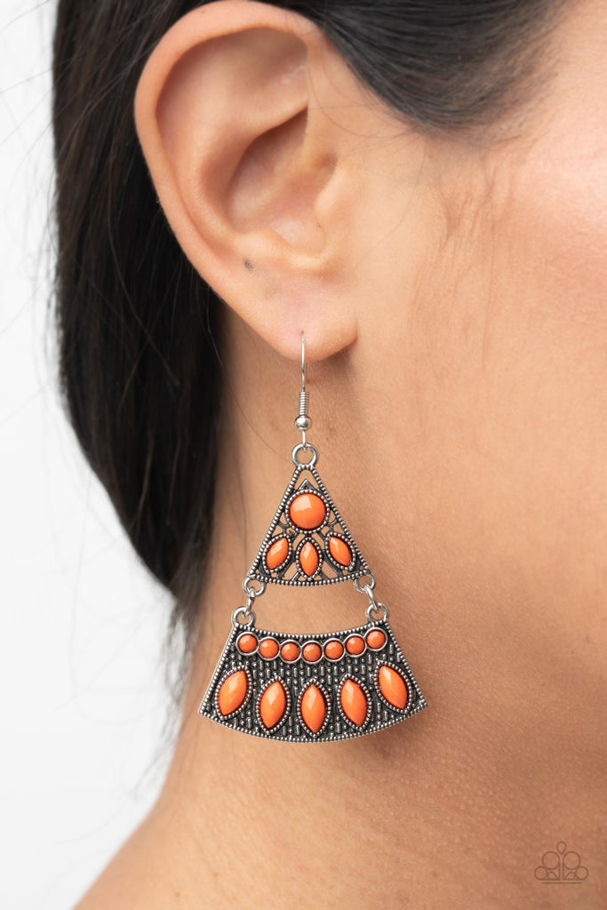 Faceted round and marquise shaped orange beads adorn the fronts of studded triangular and rectangular silver frames that link into a tribal inspired lure. Earring attaches to a standard fishhook fitting.  Sold as one pair of earrings.  