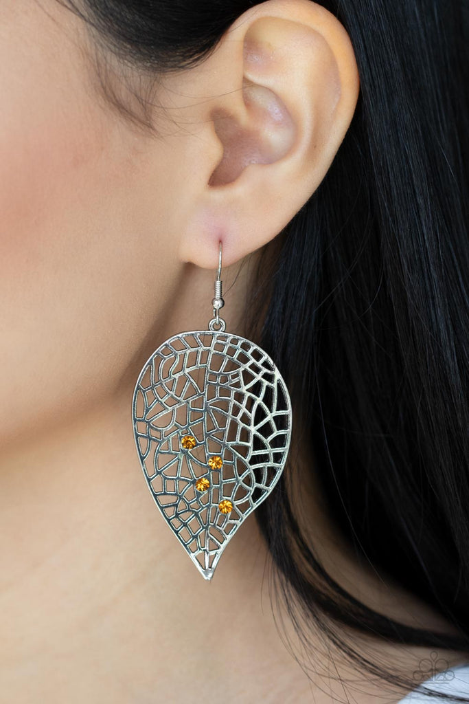 Four dainty yellow rhinestones haphazardly adorn the front a leafy silver frame filled with airy geometric detail, creating a sparkly seasonal display. Earring attaches to a standard fishhook fitting.  Sold as one pair of earrings.