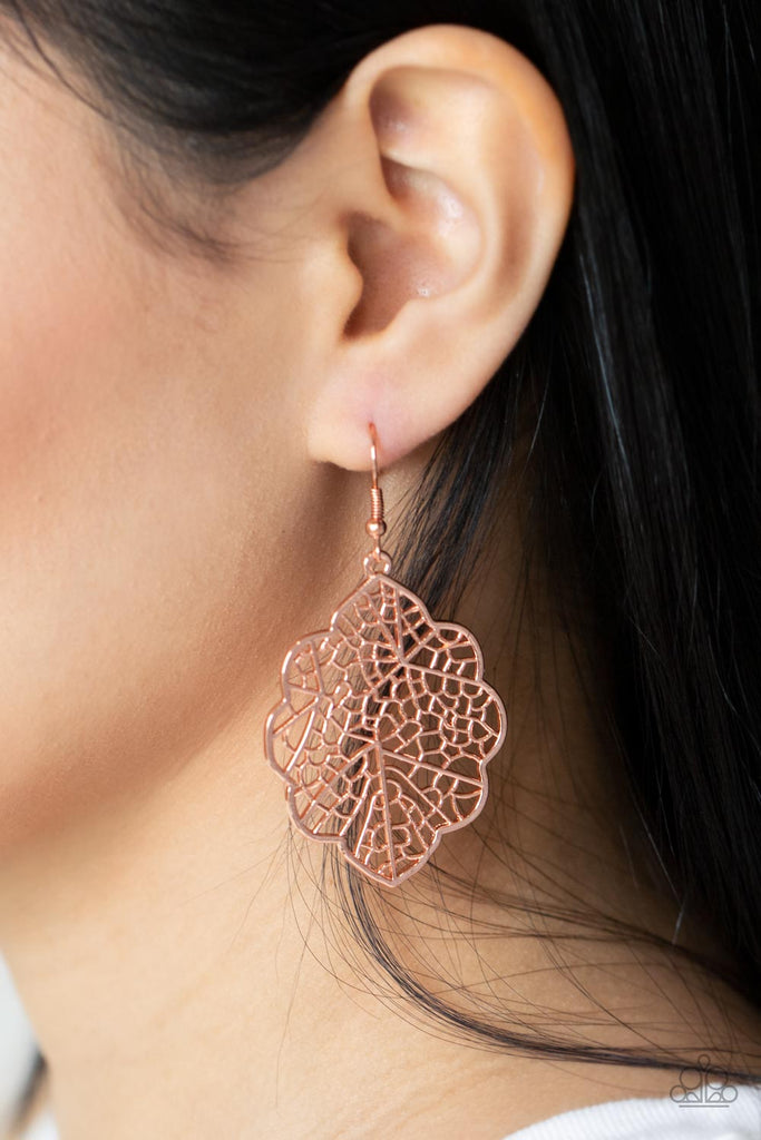 A scalloped shiny copper leafy frame is filled with a backdrop of stenciled geometric accents, creating a whimsy seasonal display. Earring attaches to a standard fishhook fitting.  Sold as one pair of earrings.