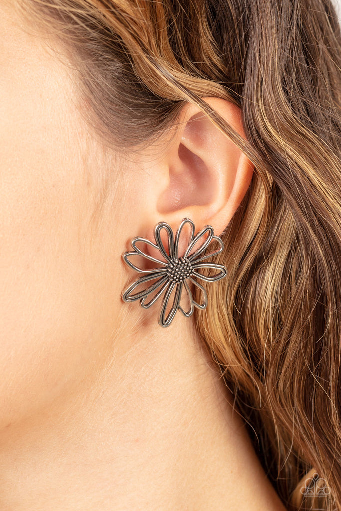 Airy silver petals bloom from a studded silver center, creating a rustic flower. Earring attaches to a standard post fitting.  Sold as one pair of post earrings.