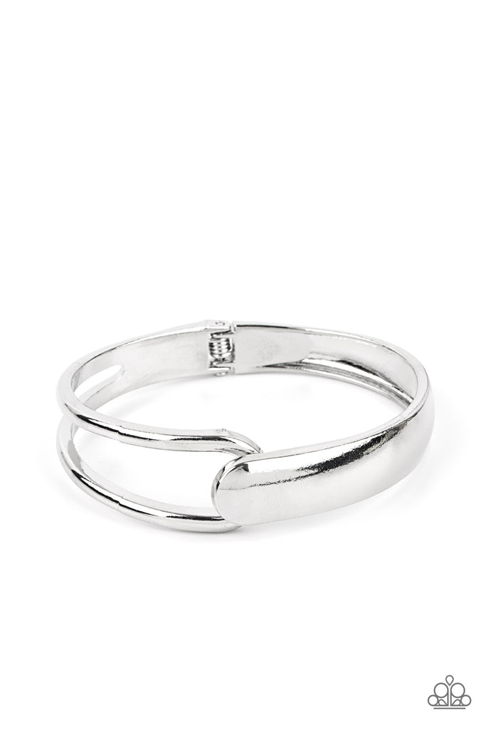 A flat silver bar and airy silver frame delicately overlap around the wrist, creating an oversized cuff-like bangle for a modern twist. Features a hinged closure.  Sold as one individual bracelet.  New Kit