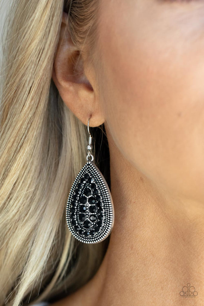 A dotted silver teardrop frame encompasses faceted black beads. The dainty beads are layered in an echoing teardrop design for a polished finish. Earring attaches to a standard fishhook fitting.  Sold as one pair of earrings.