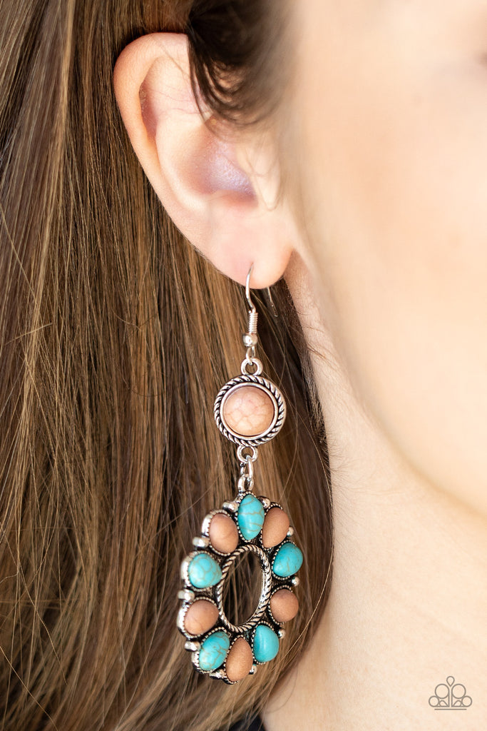 An earthy collection of brown and turquoise teardrop stones fans out from a textured silver ring. The scalloped floral frame dangles from a round brown stone encased in a braided silver fitting for a down-to-earth finish. Earring attaches to a standard fishhook fitting.  Sold as one pair of earrings.