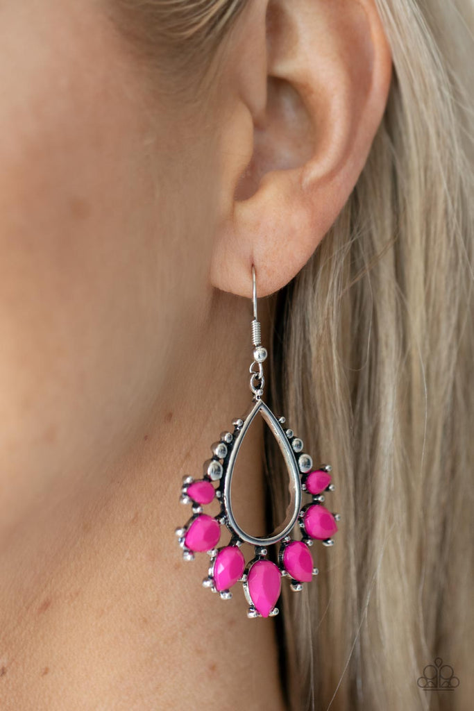Featuring studded pronged fittings, faceted Fuchsia Fedora teardrop beads flare out from the bottom of an airy silver teardrop frame for a vivacious pop of color. Earring attaches to a standard fishhook fitting.  Sold as one pair of earrings.