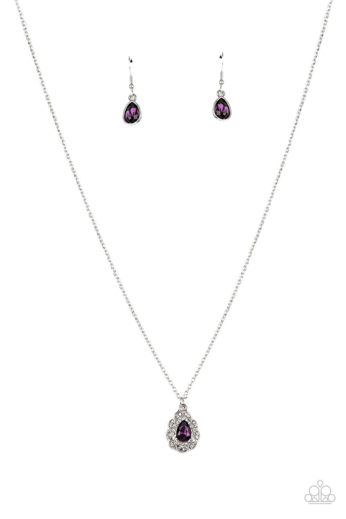vintage-validation-purple  A glittery purple teardrop gem is pressed into the center of a pronged border of glassy white rhinestones that sits atop a ring of a silver frame dotted in pairs of white rhinestones. The glittery pendant swings from the bottom dainty silver chain, creating a vintage inspired pendant below the collar. Features an adjustable clasp closure.  Sold as one individual necklace. Includes one pair of matching earrings.
